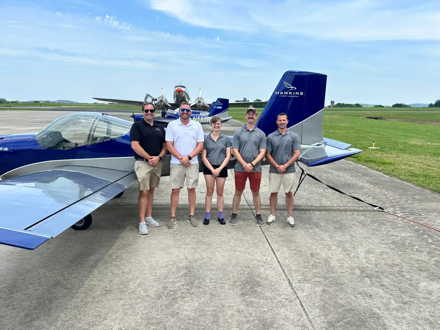 Flight instructor and student preflighting aircraft at Hawkins Flight Academy